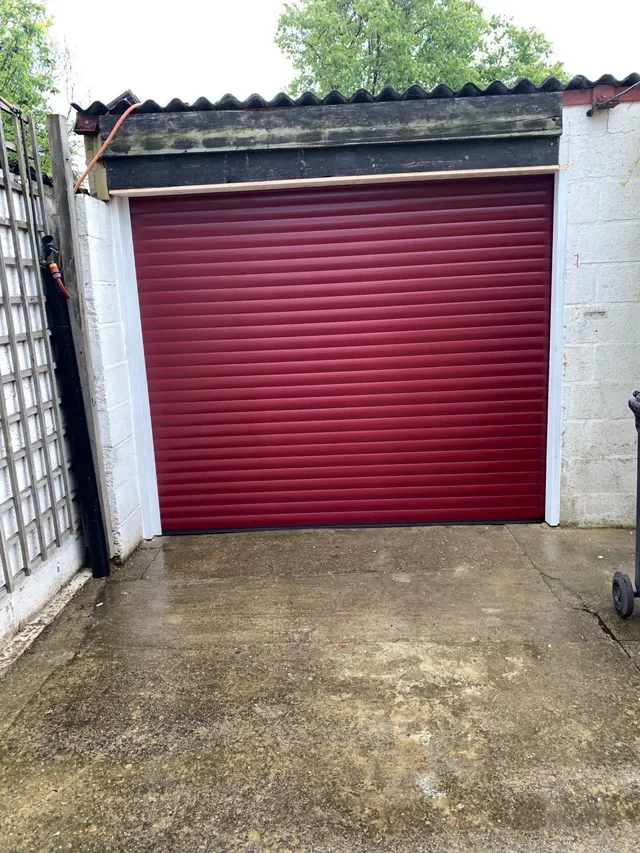 Cream up and over garage door fitted to a detached house by Doors 4 Garages Ltd