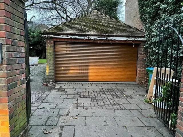 White sectional garage door installation on a suburban home in West London