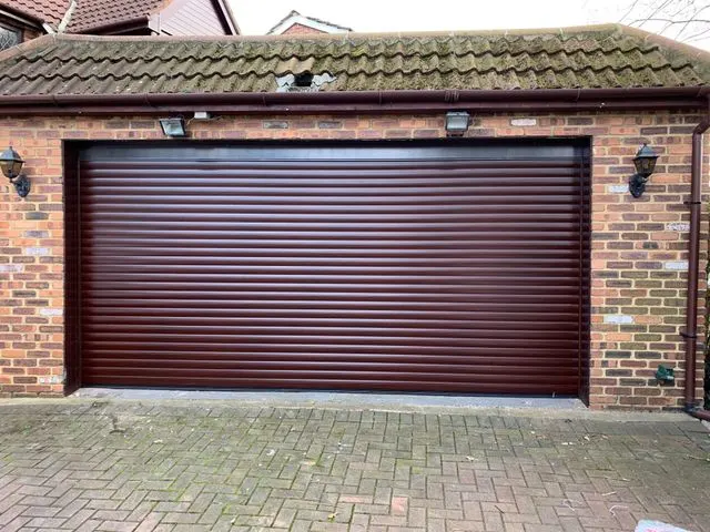 Timber effect garage door installed on a period property in Surrey