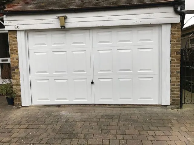 White up and over garage door replacement on a semi detached house