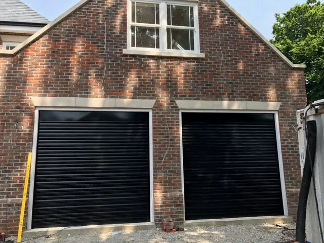 Double width garage door installation on a driveway in West London