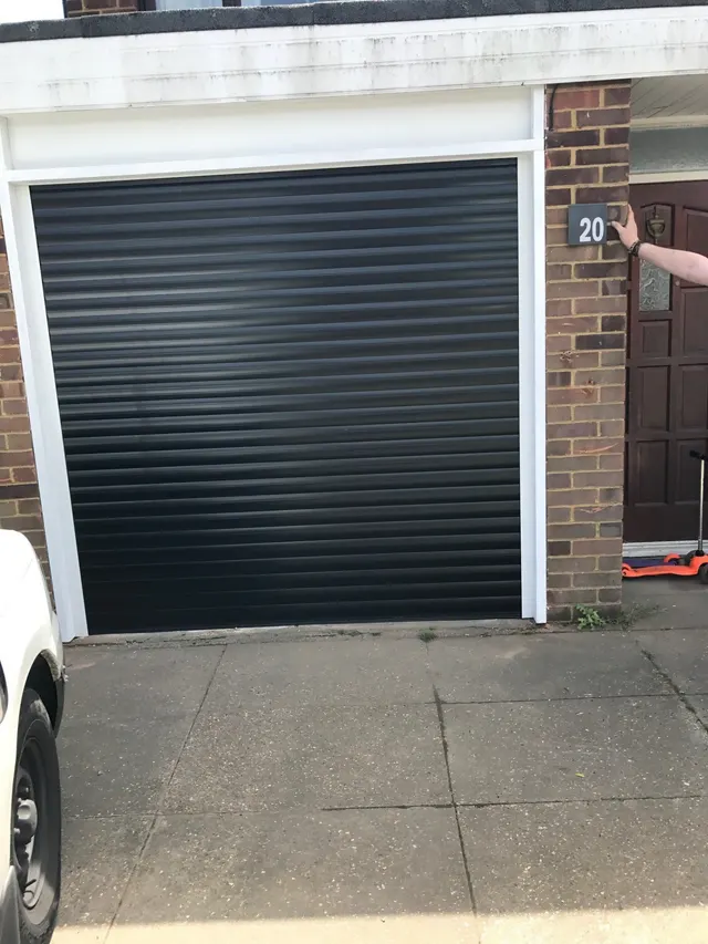 Green painted garage door fitted to a cottage style garage by Doors 4 Garages Ltd