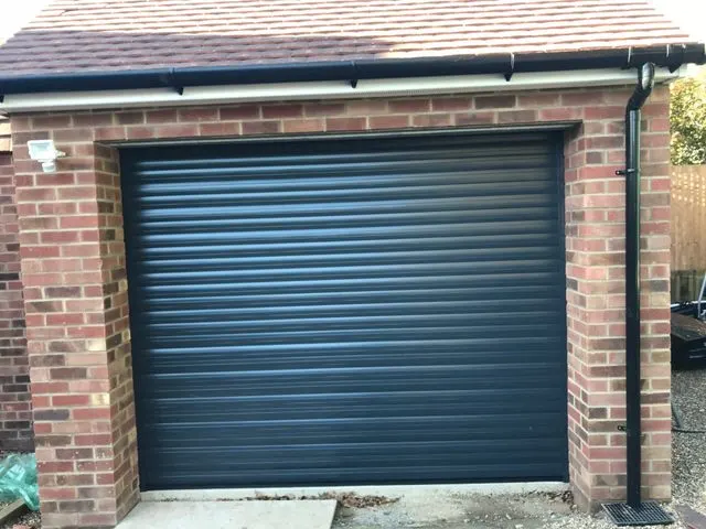 Side hung timber garage doors restored by Doors 4 Garages Ltd Twickenham
