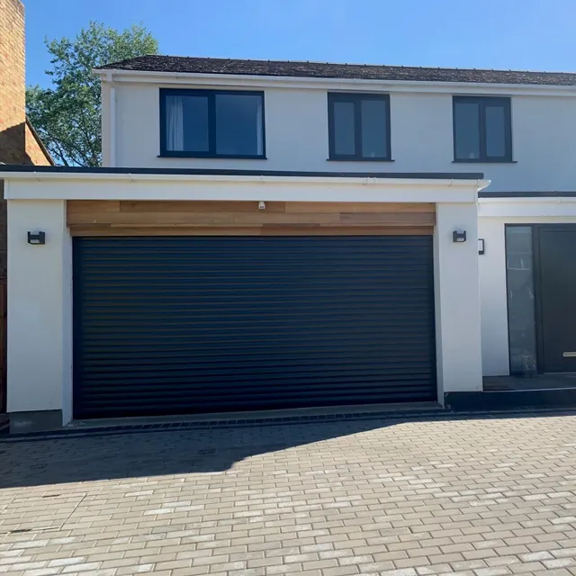 New black sectional garage door installation by Doors 4 Garages Ltd in West London