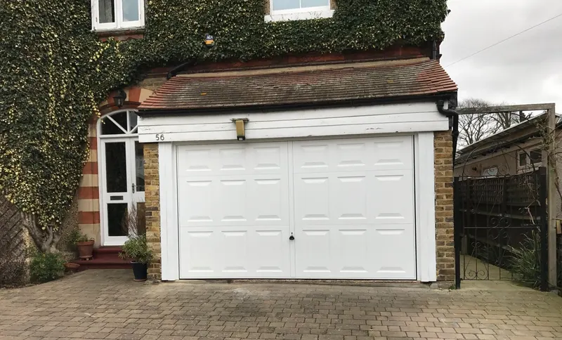 Garage door repair to a white up and over door by Doors 4 Garages Ltd Twickenham